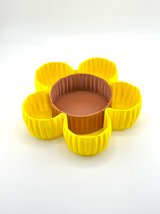 Front-facing image of Al Samer Flower Catch-All Tray with white background, showing full shape, yellow petal design, and brown center dish