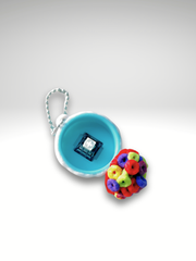 Open cereal bowl clicker showing the internal mechanical switch beneath the cereal surface