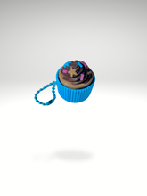 3D printed chocolate cupcake with blue sleeves fidget keychain with rich frosting detail, shown on a white background