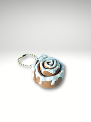 3D printed classic cinnamon roll fidget toy with frosted swirl design in white background showing the side of cinnamon roll and ball bead chain