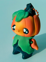 Detailed close-up of the ombré orange head and leafy stem on the 3D printed pumpkin charm