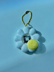 3D printed daisy flower keychain opened to show the internal key switch used for clicking functionality