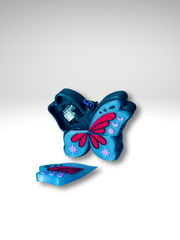 Dark Pixie keychain showing key switch for fidget clicking