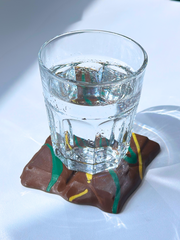 Dubai Chocolate Coaster holding a glass of water on top, demonstrating coaster function and durability