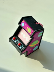 Galaxy Retro Arcade Clicky Pal – purple 3D printed mini arcade cabinet clicker keychain with planets and a cosmic pink screen | Dubai 3D Printing