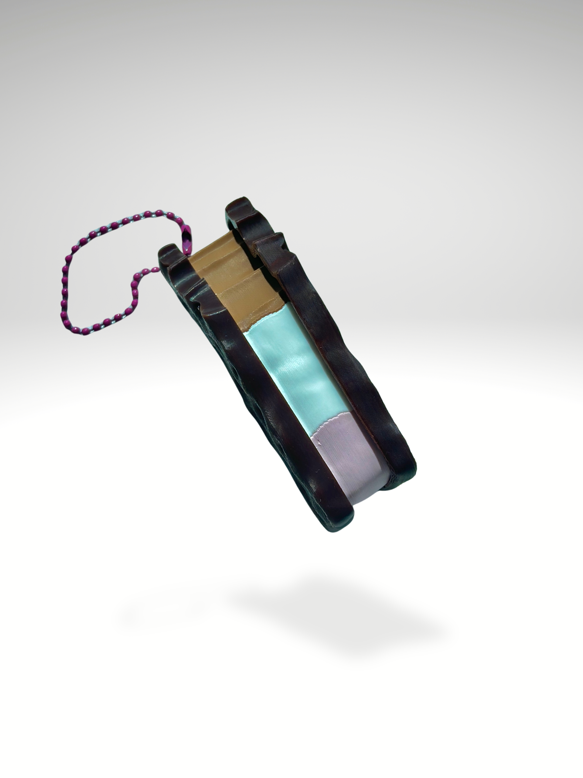 Neapolitan ice cream sandwich clicker showing layered vanilla, chocolate, and strawberry filling in a side view