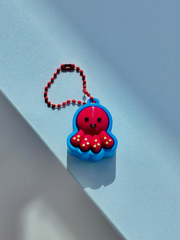 3D printed octopus fidget toy keychain with rounded body and tentacle design on a white background