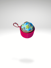 3D printed vanilla cupcake clicker with pink sleeves keychain with swirled frosting, displayed on a clean white background
