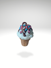 3D printed vanilla ice cream cone clicker keychain topped with chocolate fudge sauce and colorful sprinkles, displayed on a white background