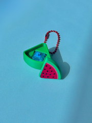 3D printed watermelon slice clicker keychain with top removed to reveal the internal mechanical key switch used for clicking