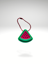3D printed watermelon slice fidget toy keychain with red “flesh,” green rind, and black seed details, displayed on a white background