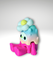 Woobu Daisy Spinner placed on a desk sitting side view