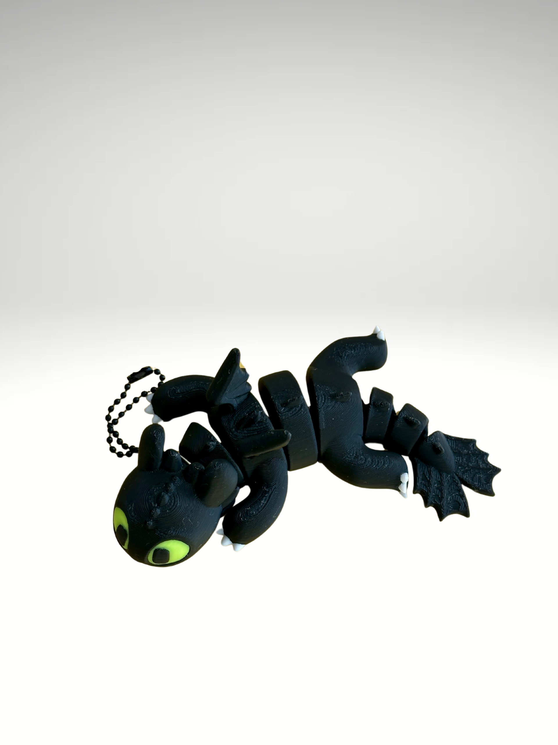 Black 3D printed Toothless dragon bag charm with wings
