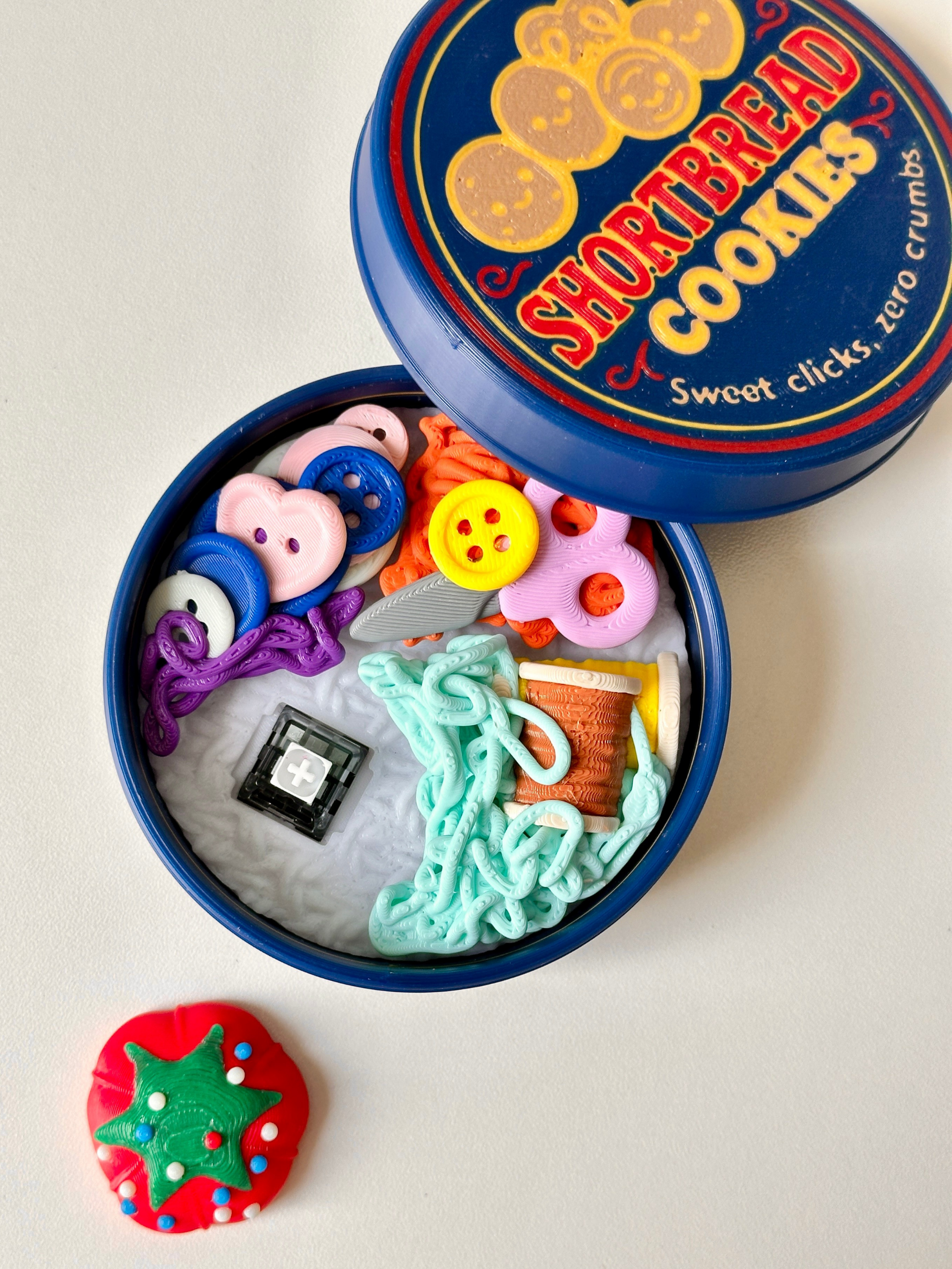 3D Printed Cookie Tin Sewing Box Clicker Set – Button Clickers in Cookie Tin Case | – close-up | Dubai 3D Printing