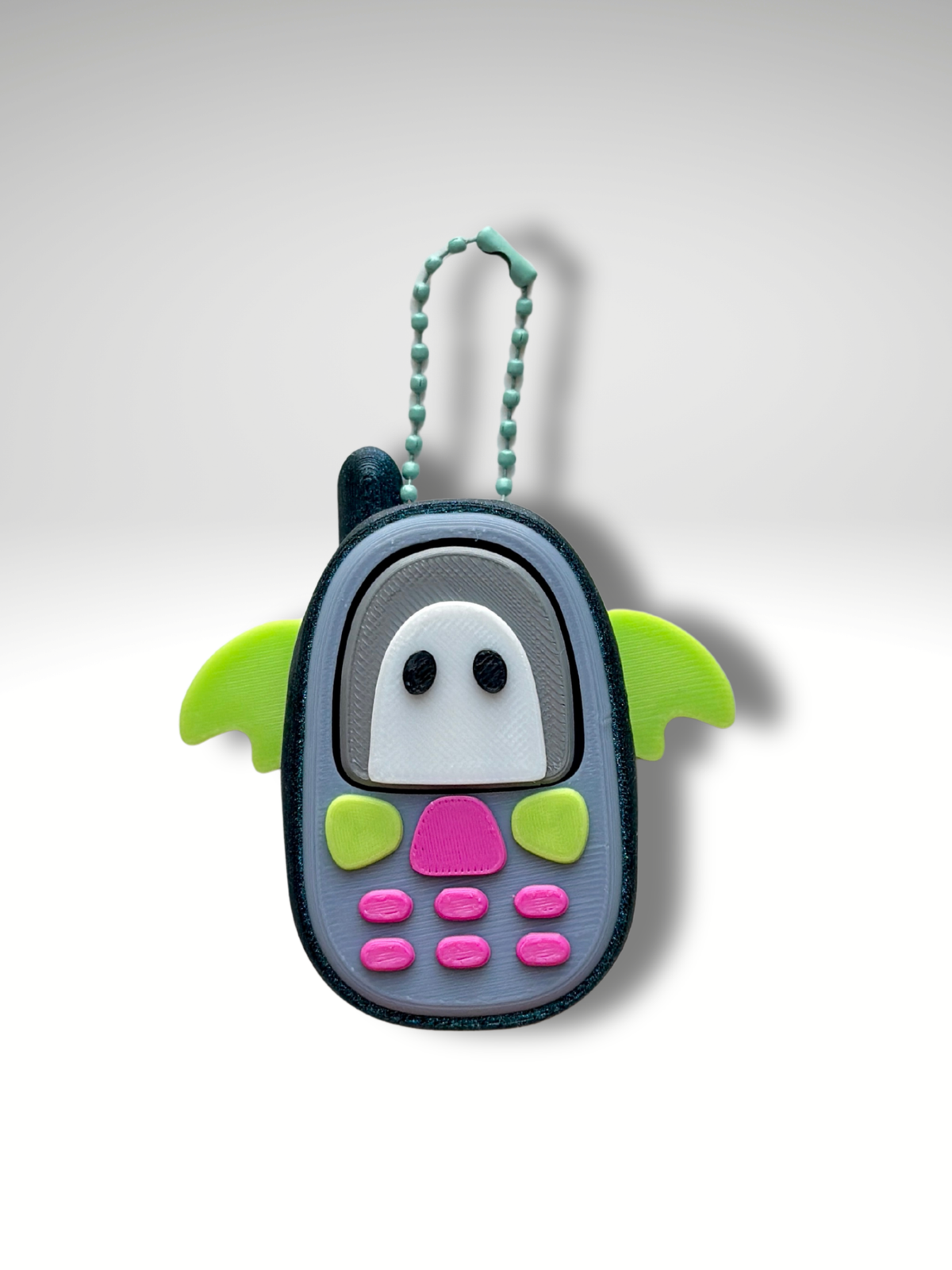 Bat Retro Phone Clicky Pal – grey 3D printed clicker phone keychain with a ghost screen and green bat wings | Dubai 3D Printing
