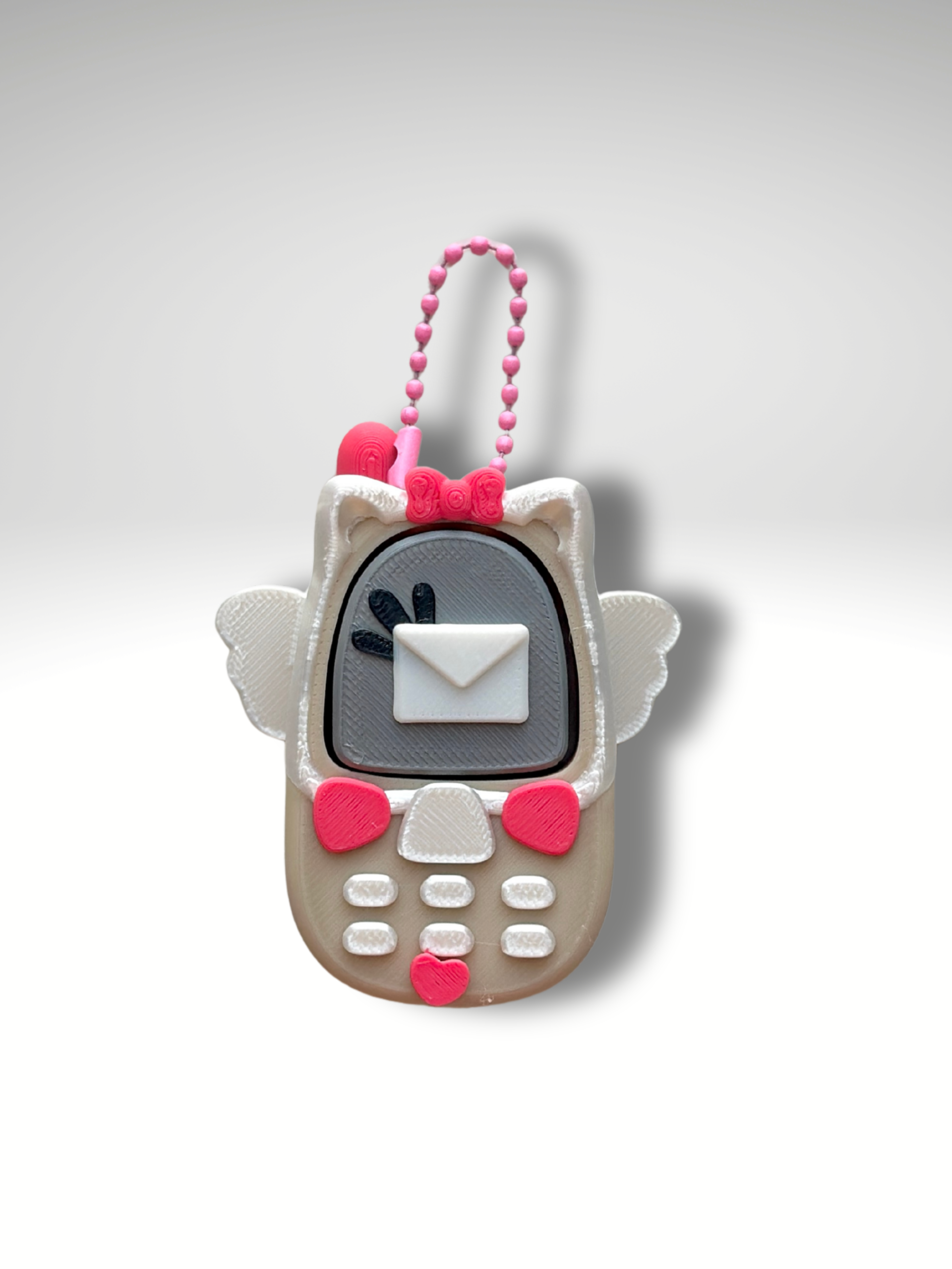 Cupid Retro Phone Clicky Pal – cream 3D printed clicker phone keychain with angel wings, a love-letter screen and pink hearts | Dubai 3D Printing