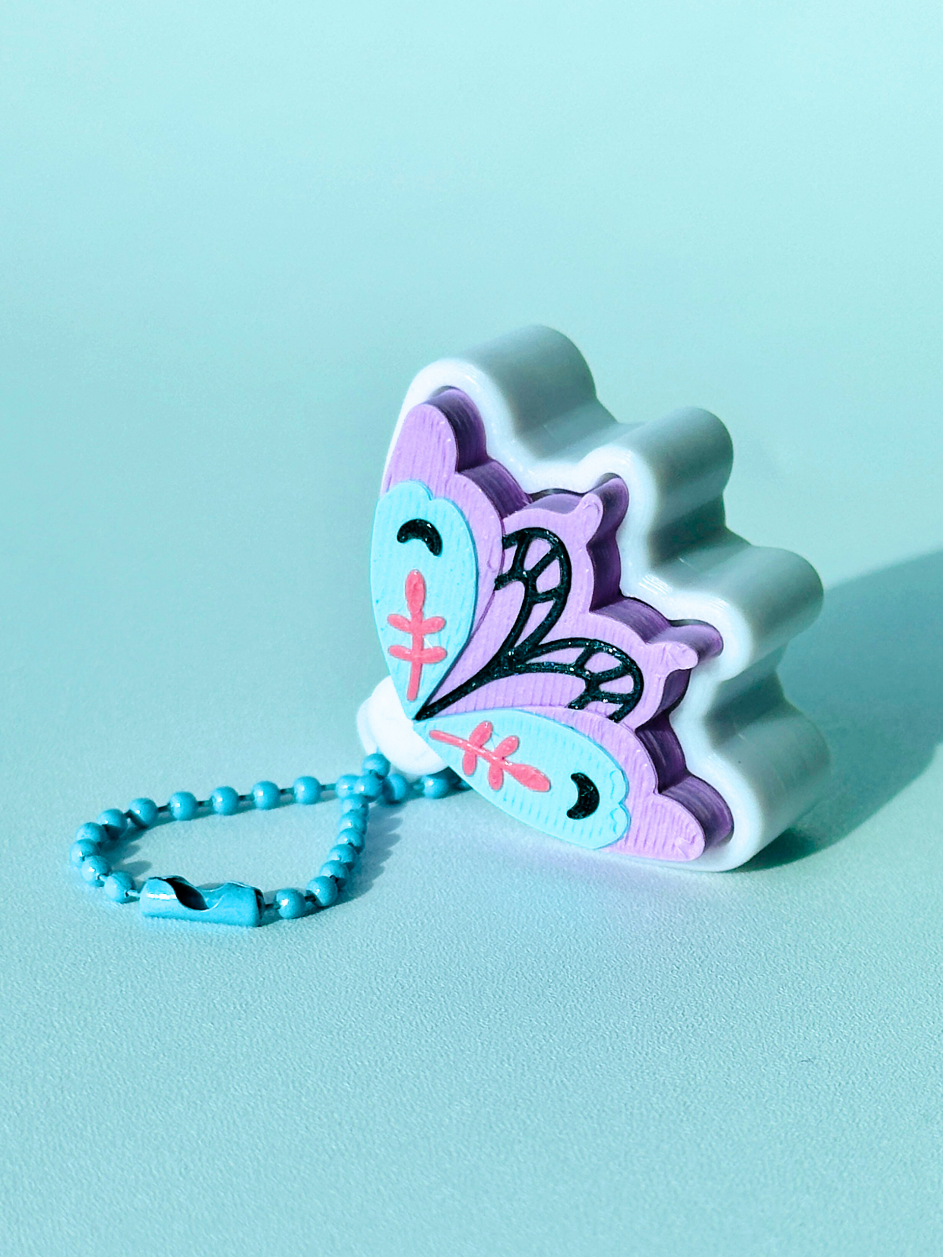 3D printed light purple pixie-shaped fidget toy with clicky wing design close-up