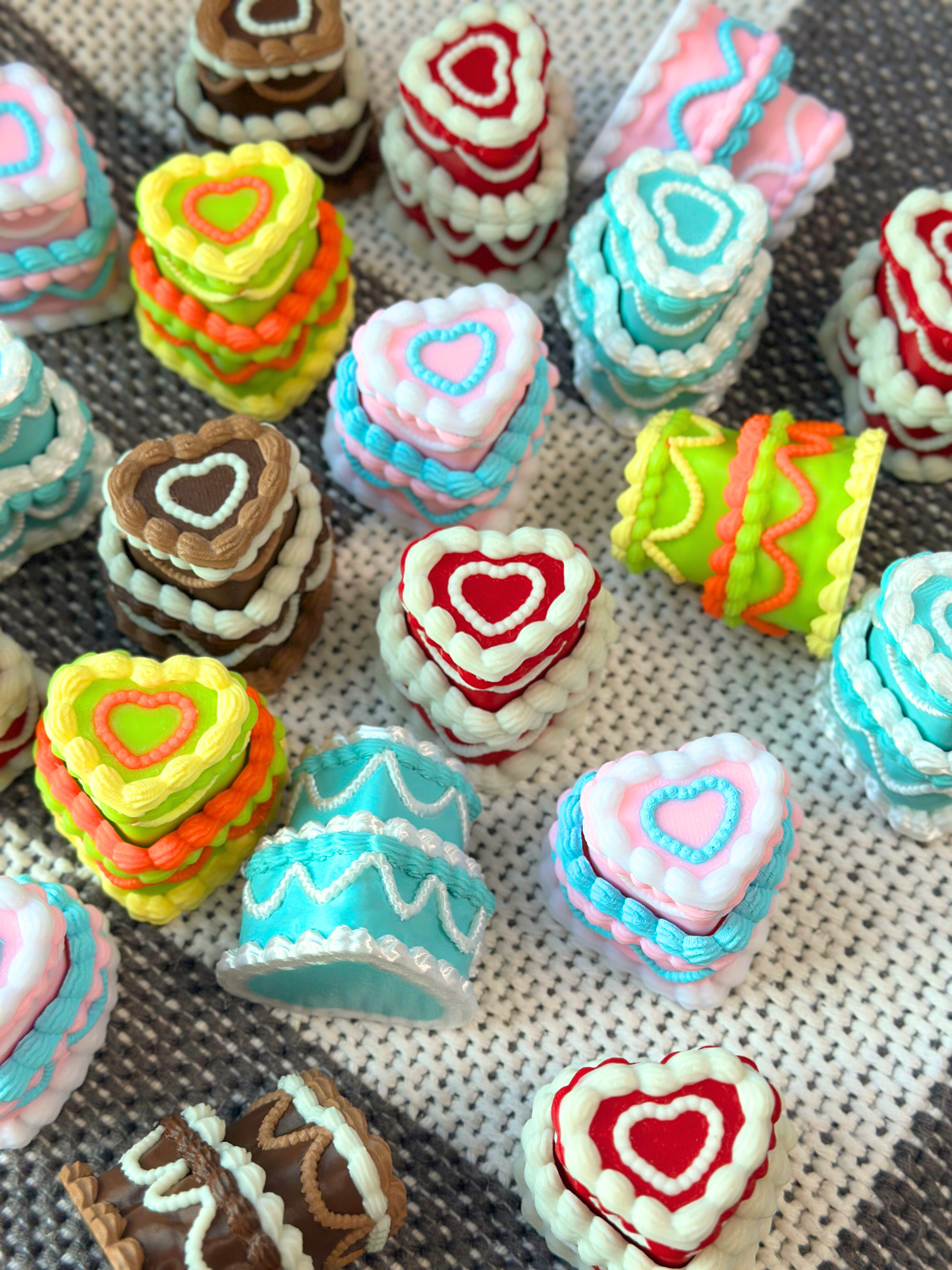 heart shaped tiered cake laid on a carpet