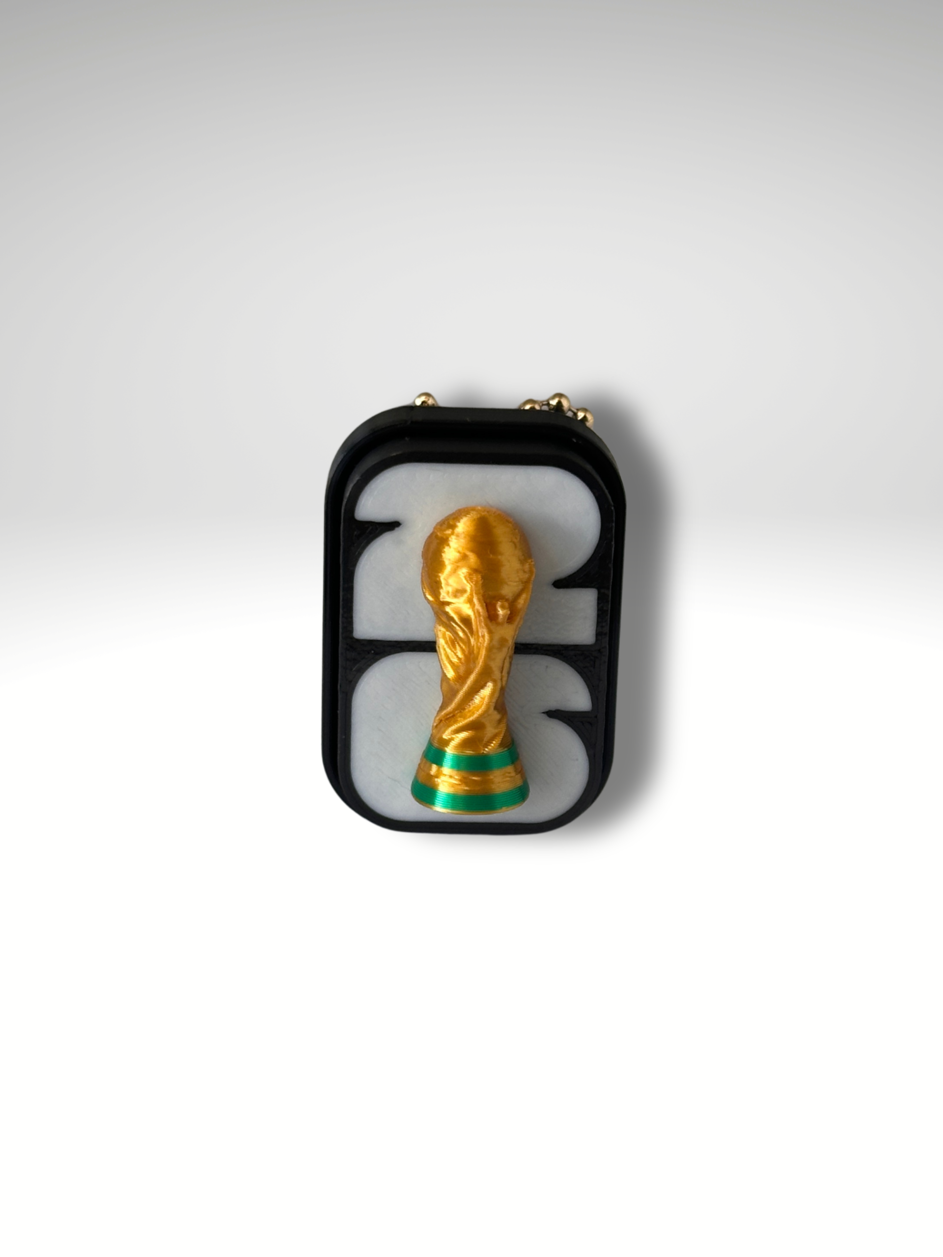 FIFA 2026 badge clicker front view with World Cup trophy detail